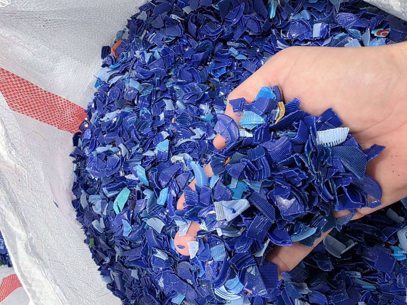 Clean blue HDPE flake — ready for its second life
